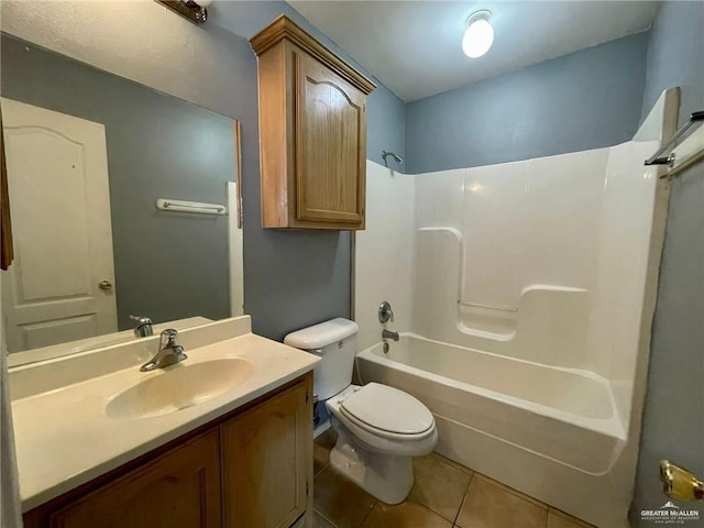 bathroom featuring washtub / shower combination, vanity, toilet, and tile patterned floors