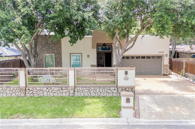 pueblo-style home with a garage