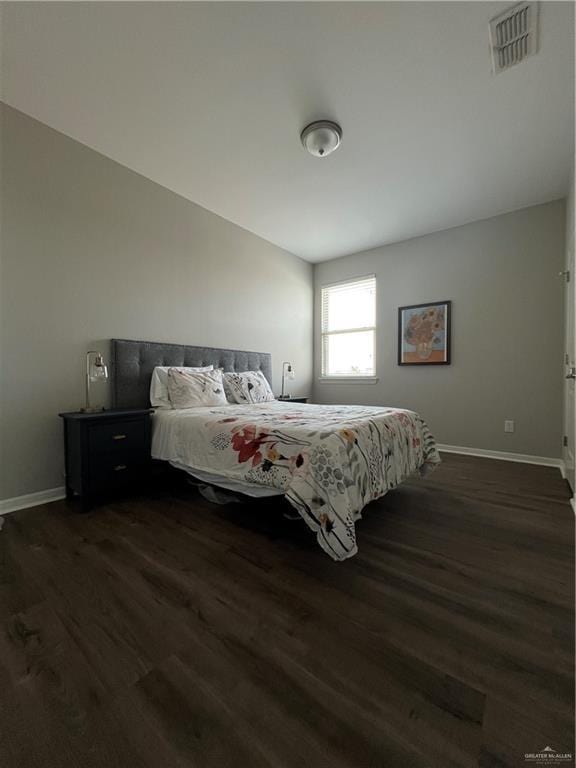 10228 N 14th St, Mcallen, TX 78504 - bedroom featuring dark wood-style floors and baseboards