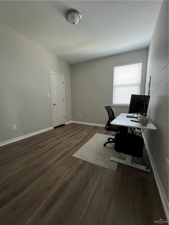 10228 N 14th St, Mcallen, TX 78504 - office featuring dark wood-type flooring and baseboards