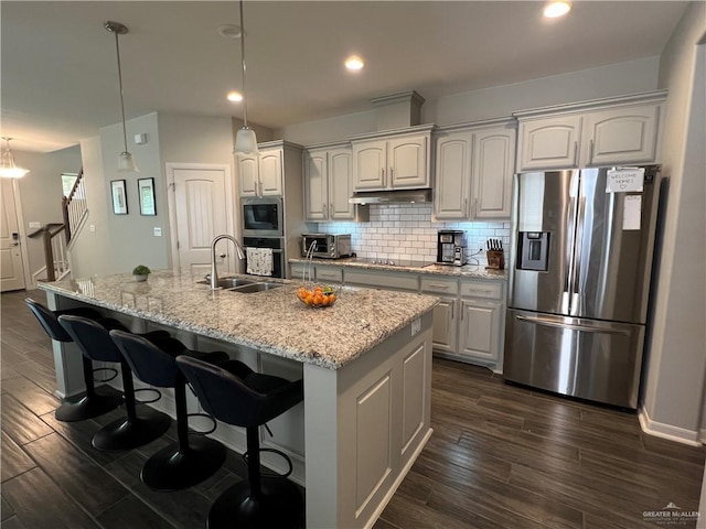 10228 N 14th St, Mcallen, TX 78504 - kitchen featuring stainless steel appliances, dark wood-style floors, decorative backsplash, an island with sink, and recessed lighting