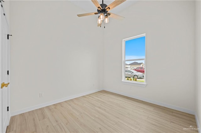 empty room with light hardwood / wood-style flooring and ceiling fan