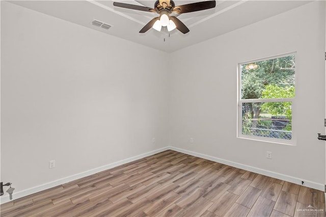 empty room featuring ceiling fan and light wood-type flooring