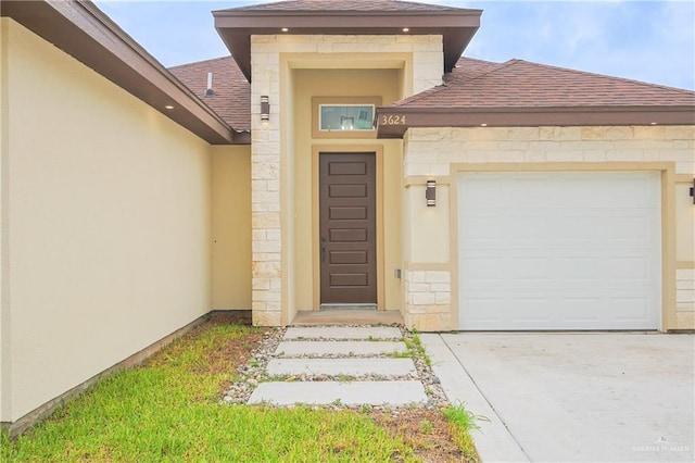 view of exterior entry featuring a garage