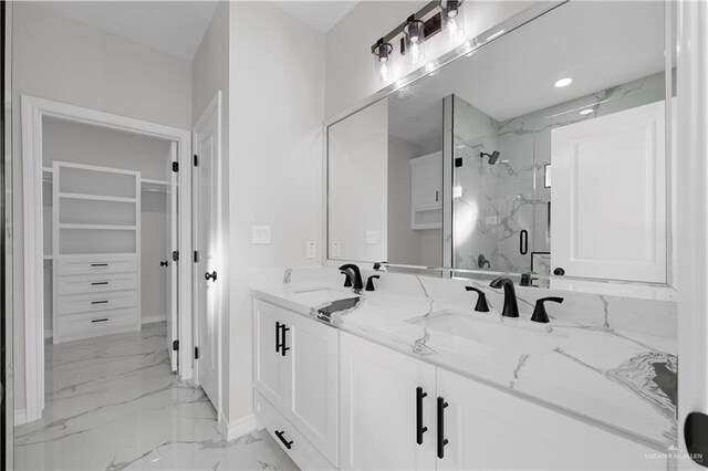 bathroom with vanity, toilet, and a shower with shower door