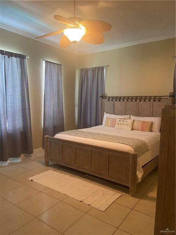 bedroom featuring ceiling fan, light tile patterned flooring, and ornamental molding