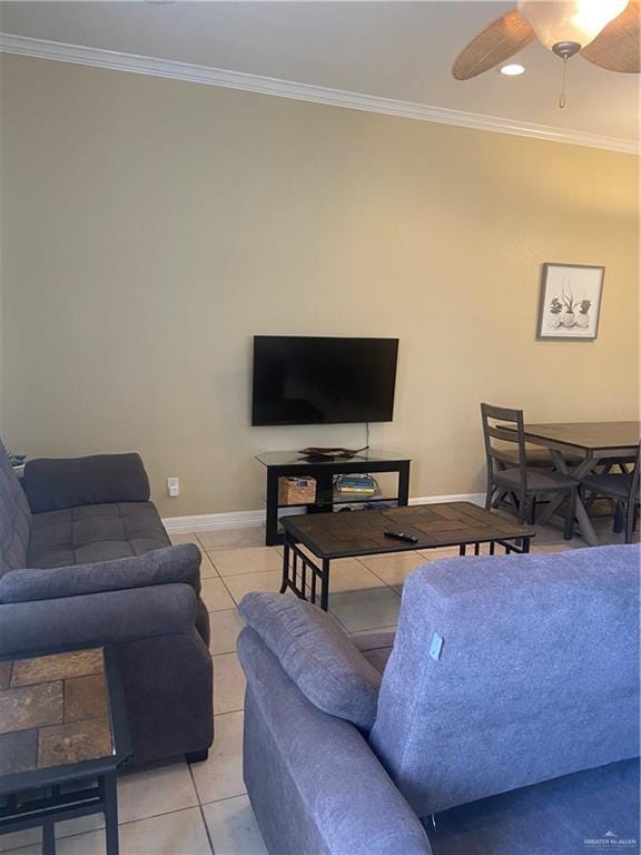 living room with ceiling fan, light tile patterned flooring, and ornamental molding