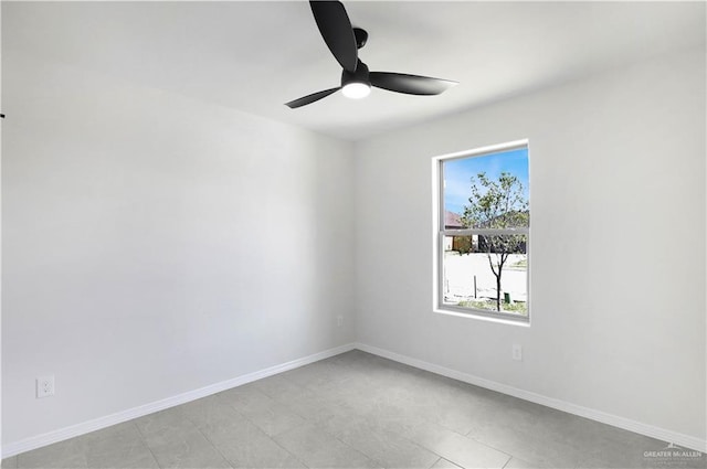 unfurnished room featuring baseboards, ceiling fan, and light tile patterned floors