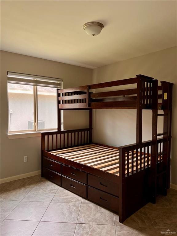 unfurnished bedroom featuring light tile patterned flooring