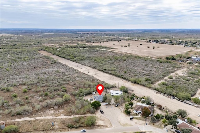 birds eye view of property featuring a rural view