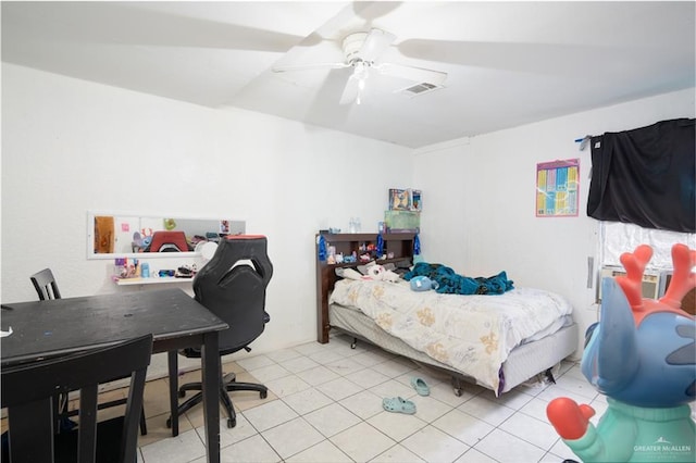 bedroom featuring light tile patterned floors and ceiling fan