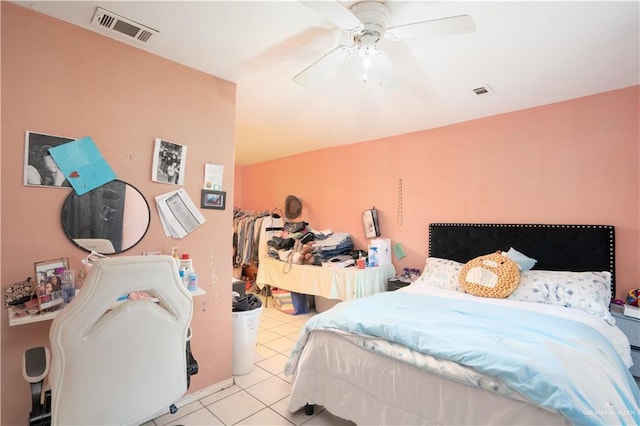 bedroom with ceiling fan and light tile patterned flooring