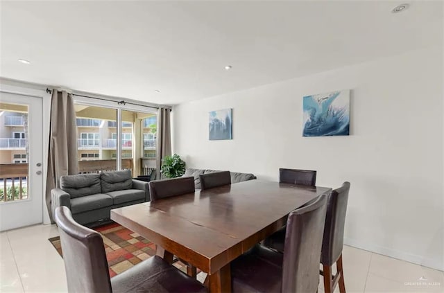 dining area with light tile patterned floors and plenty of natural light