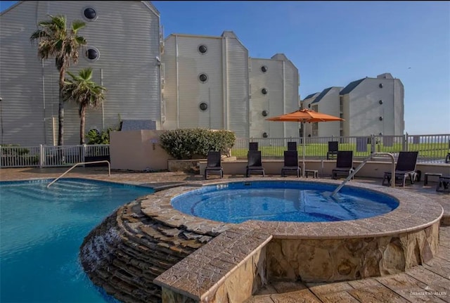 view of pool featuring a community hot tub