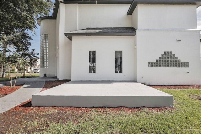 3207 E San Luis Cir, Mission, TX 78573 - back of house featuring stucco siding and a patio
