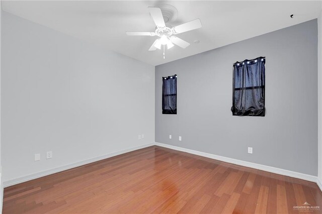 3207 E San Luis Cir, Mission, TX 78573 - spare room featuring wood finished floors, baseboards, and a ceiling fan