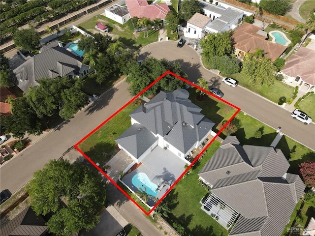 3207 E San Luis Cir, Mission, TX 78573 - aerial perspective of suburban area with a pool area and property boundaries highlighted