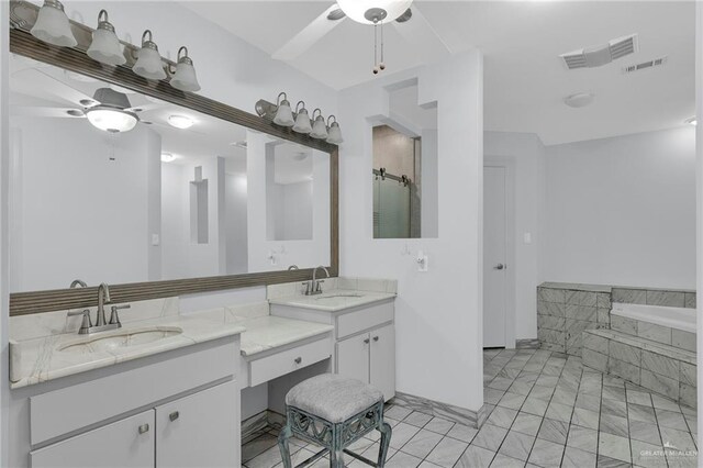 3207 E San Luis Cir, Mission, TX 78573 - full bath with ceiling fan, a garden tub, vanity, and marble finish floors