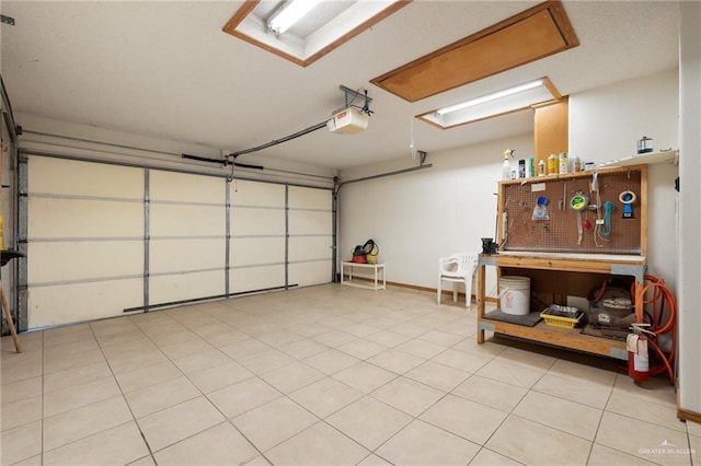 garage featuring a workshop area and a garage door opener