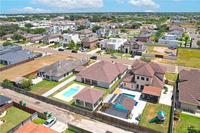 birds eye view of property with a residential view