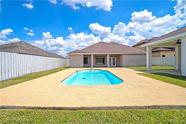 view of pool featuring a fenced backyard, a fenced in pool, a patio, and french doors