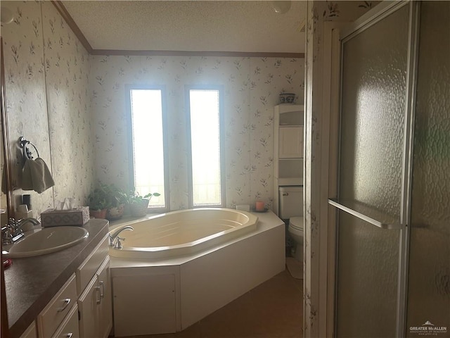 full bathroom featuring separate shower and tub, a textured ceiling, toilet, vanity, and ornamental molding