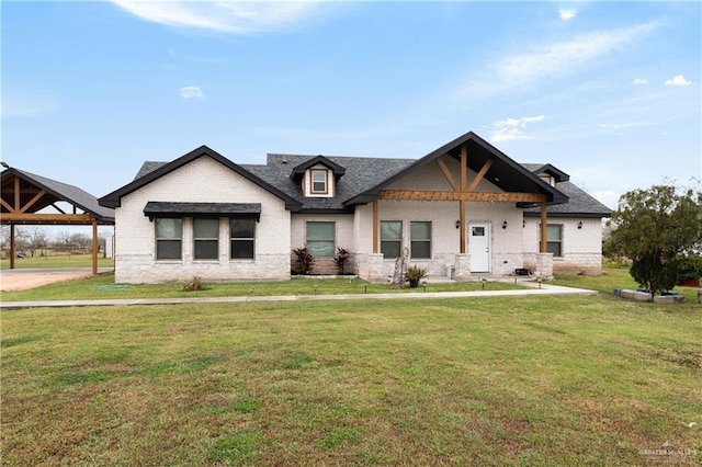 view of front of house featuring brick siding and a front lawn