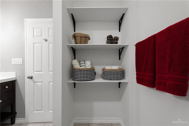 spacious closet featuring light tile patterned flooring