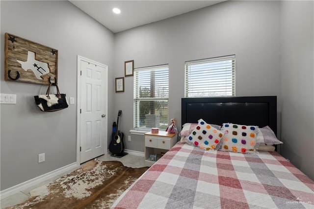 bedroom featuring baseboards and recessed lighting