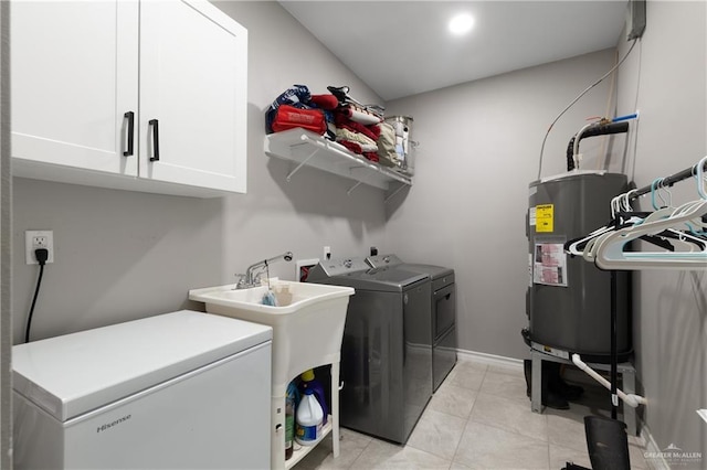 washroom with light tile patterned floors, recessed lighting, cabinet space, electric water heater, and separate washer and dryer