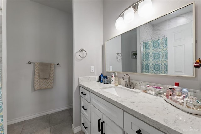 bathroom with tile patterned flooring, a shower with shower curtain, vanity, and baseboards