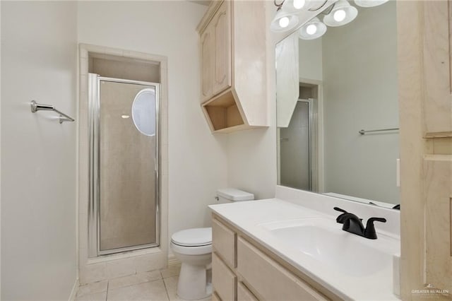 full bathroom featuring vanity, toilet, a shower stall, and tile patterned flooring