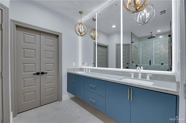 bathroom with a chandelier, vanity, and an enclosed shower