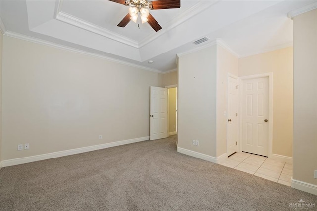 5501 N 1st Ln, Mcallen, TX 78504 - spare room featuring carpet flooring, a ceiling fan, a raised ceiling, crown molding, and baseboards
