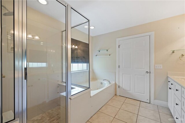 5501 N 1st Ln, Mcallen, TX 78504 - bathroom featuring a shower stall, tile patterned flooring, vanity, and a garden tub