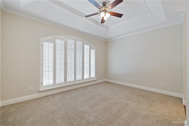 5501 N 1st Ln, Mcallen, TX 78504 - carpeted empty room featuring a tray ceiling, healthy amount of natural light, ceiling fan, crown molding, and baseboards