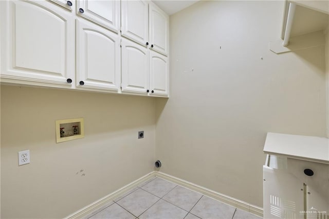 5501 N 1st Ln, Mcallen, TX 78504 - laundry area featuring cabinet space, baseboards, hookup for an electric dryer, hookup for a washing machine, and light tile patterned flooring