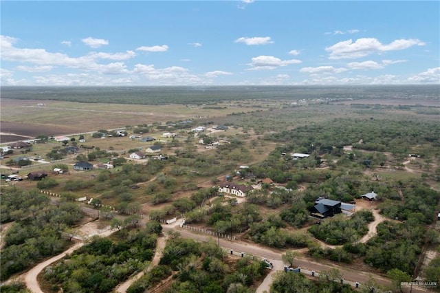 birds eye view of property featuring a rural view