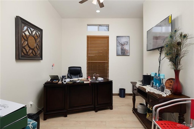 office area with ceiling fan and light hardwood / wood-style floors