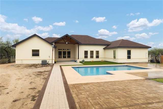 view of pool with central AC unit and a patio area