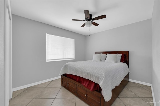 bedroom with light tile patterned floors, baseboards, and ceiling fan