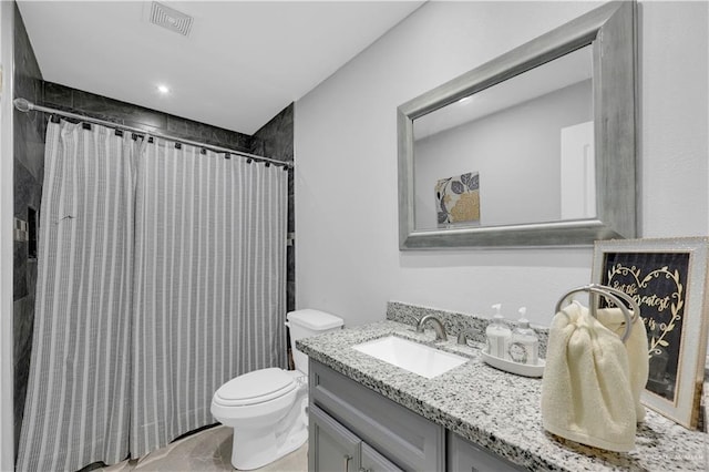 bathroom featuring visible vents, toilet, curtained shower, and vanity