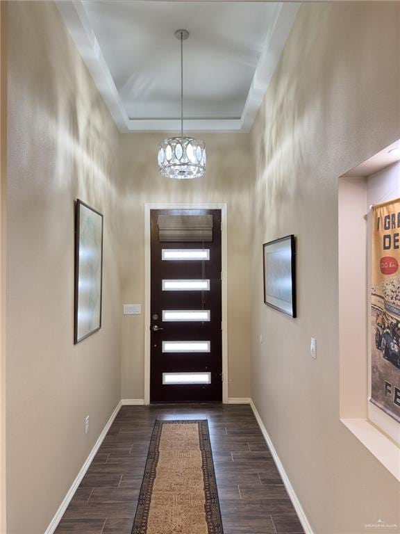 1419 Frente Al Mar Dr, Weslaco, TX 78596 - entryway with dark wood finished floors, baseboards, and a chandelier