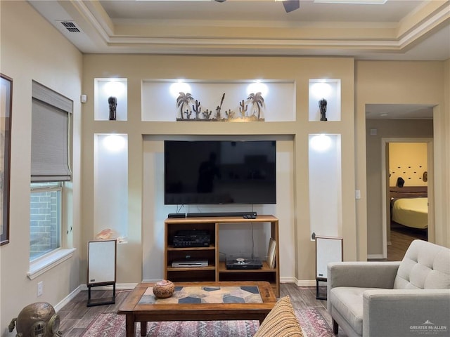 1419 Frente Al Mar Dr, Weslaco, TX 78596 - living room with visible vents, wood finished floors, and a tray ceiling