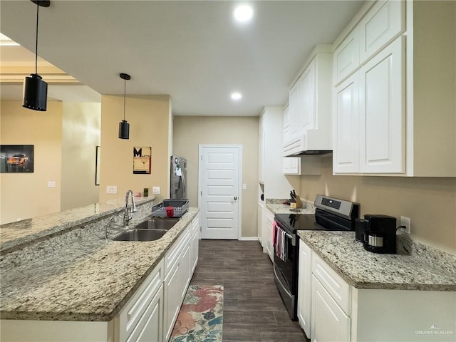1419 Frente Al Mar Dr, Weslaco, TX 78596 - kitchen featuring appliances with stainless steel finishes, white cabinets, a sink, a peninsula, and dark wood-type flooring