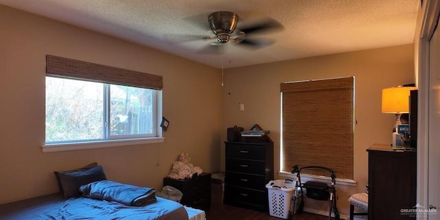 2219 Ella Ave, Harlingen, TX 78550 - bedroom featuring a textured ceiling and dark wood finished floors