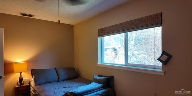 2219 Ella Ave, Harlingen, TX 78550 - sitting room with a textured ceiling and a ceiling fan