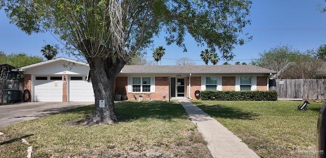 2219 Ella Ave, Harlingen, TX 78550 - single story home featuring driveway, a garage, and brick siding