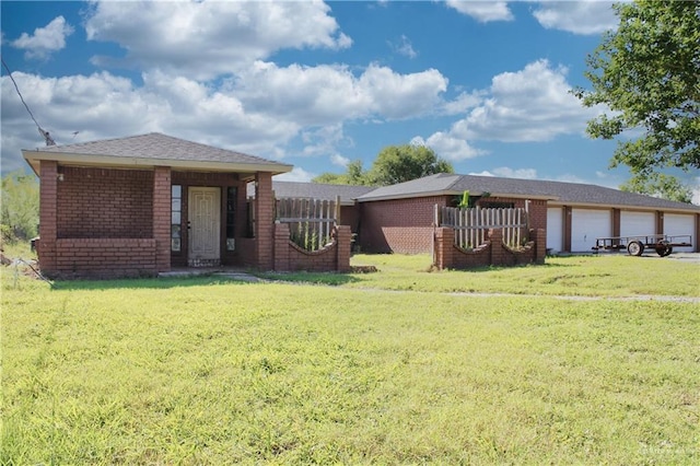 28099 Nelson Rd, San Benito, TX 78586 - view of front facade with brick siding and a front yard