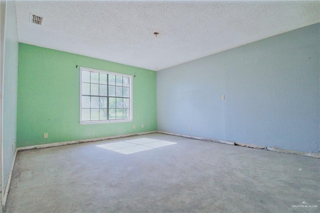 28099 Nelson Rd, San Benito, TX 78586 - carpeted spare room featuring a textured ceiling and baseboards